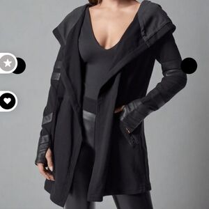 Blanc Noir travel coat.  Leather detailing, and satin hood.